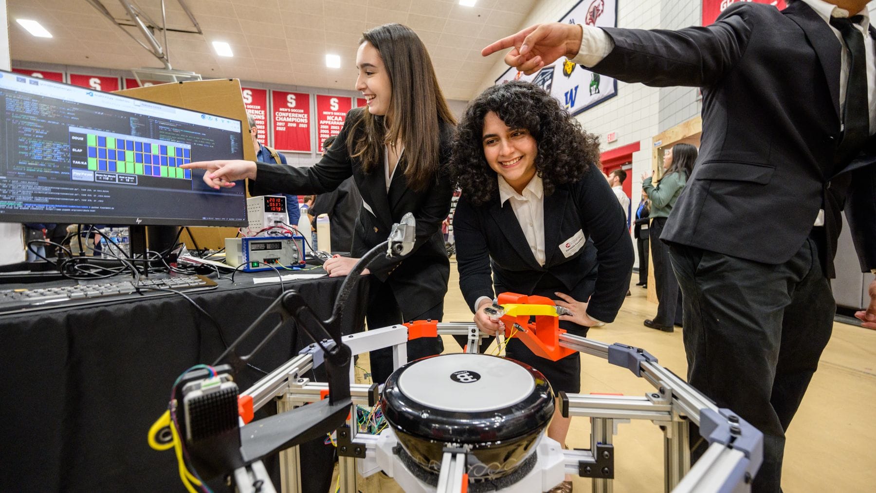 Students displaying a tech project in arena at 2024 Stevens Innovation Expo