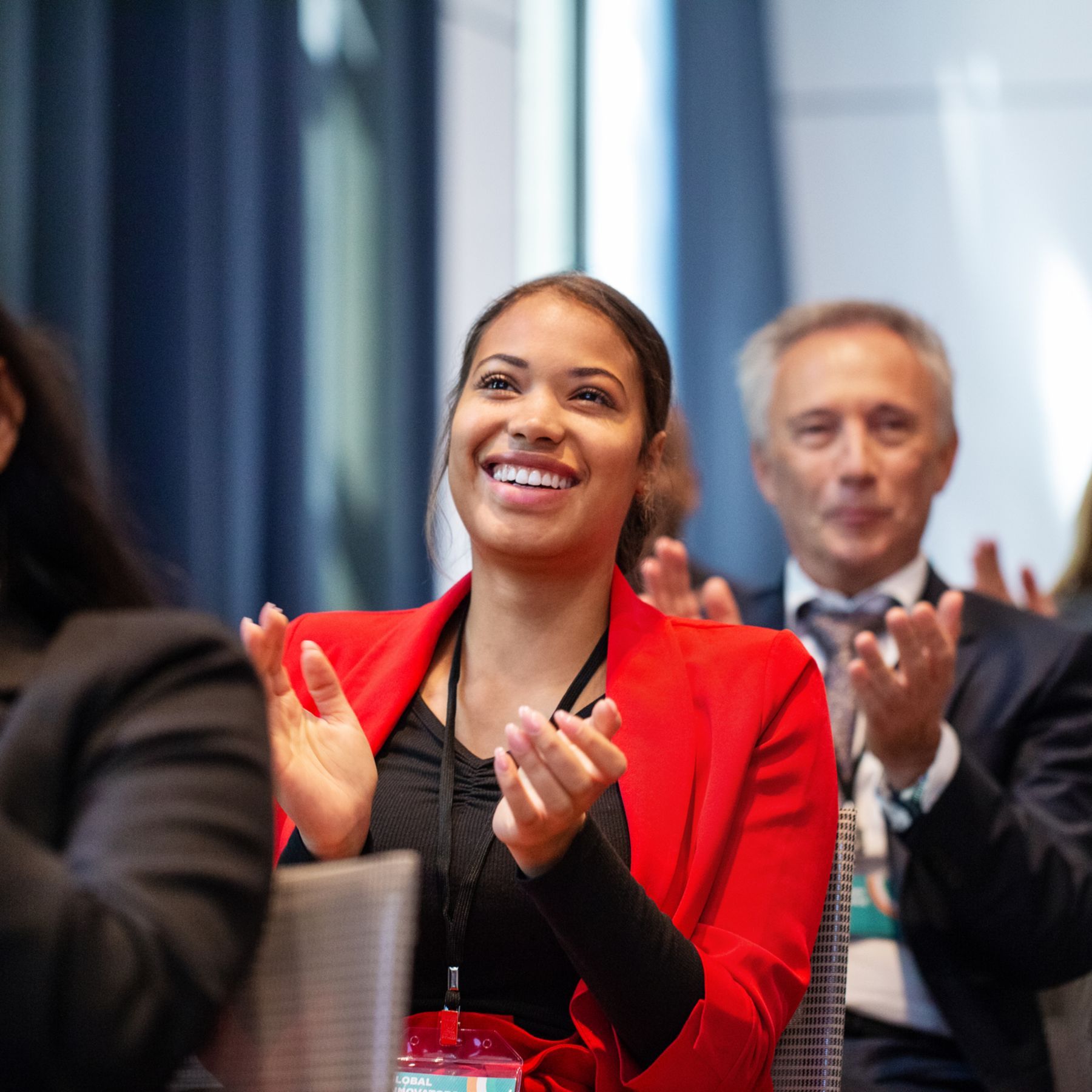 smiling business woman in red suit 