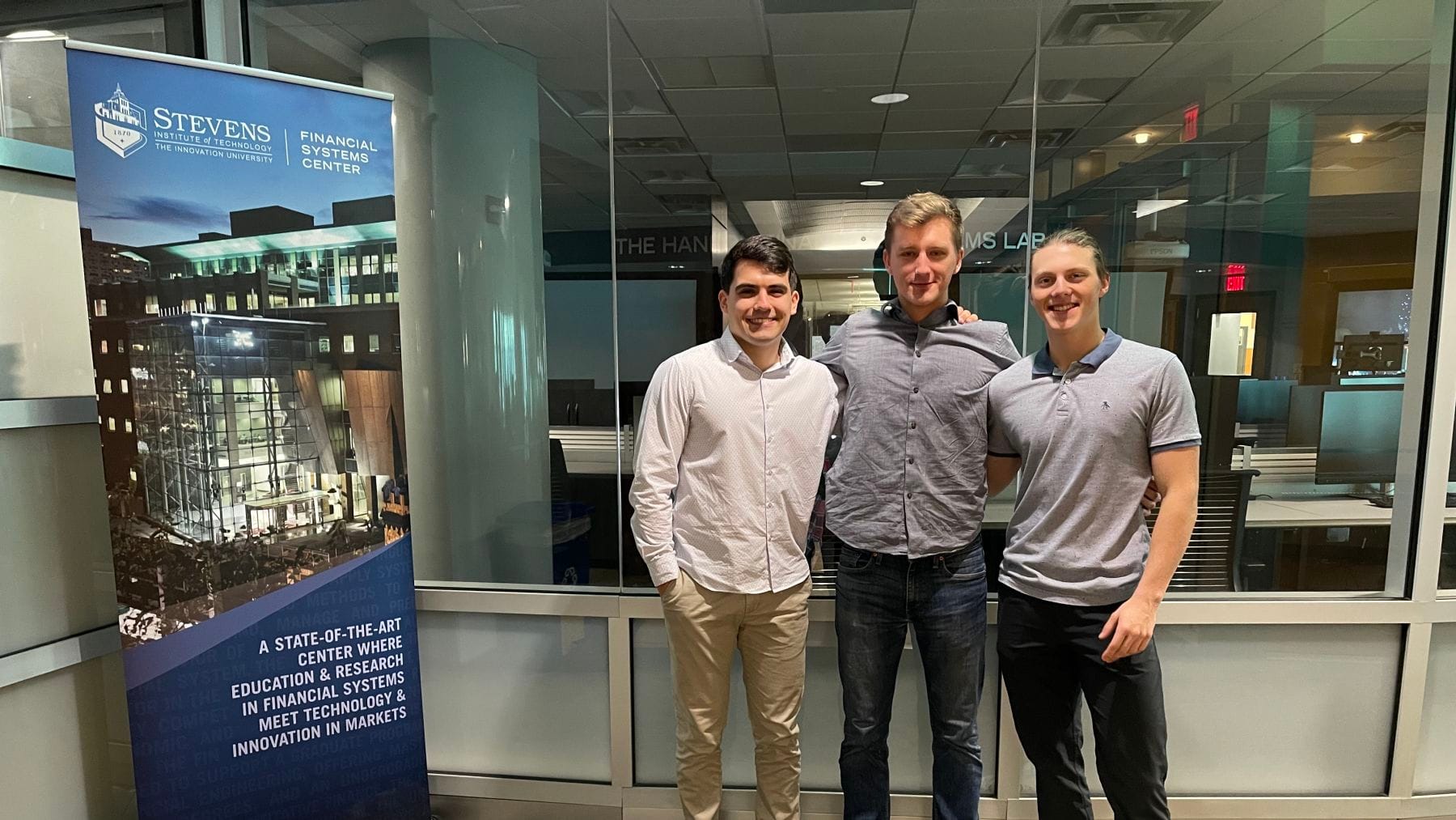 Lech, Stepanyan, and Moszczynski outside the Hanlon Financial Systems Center