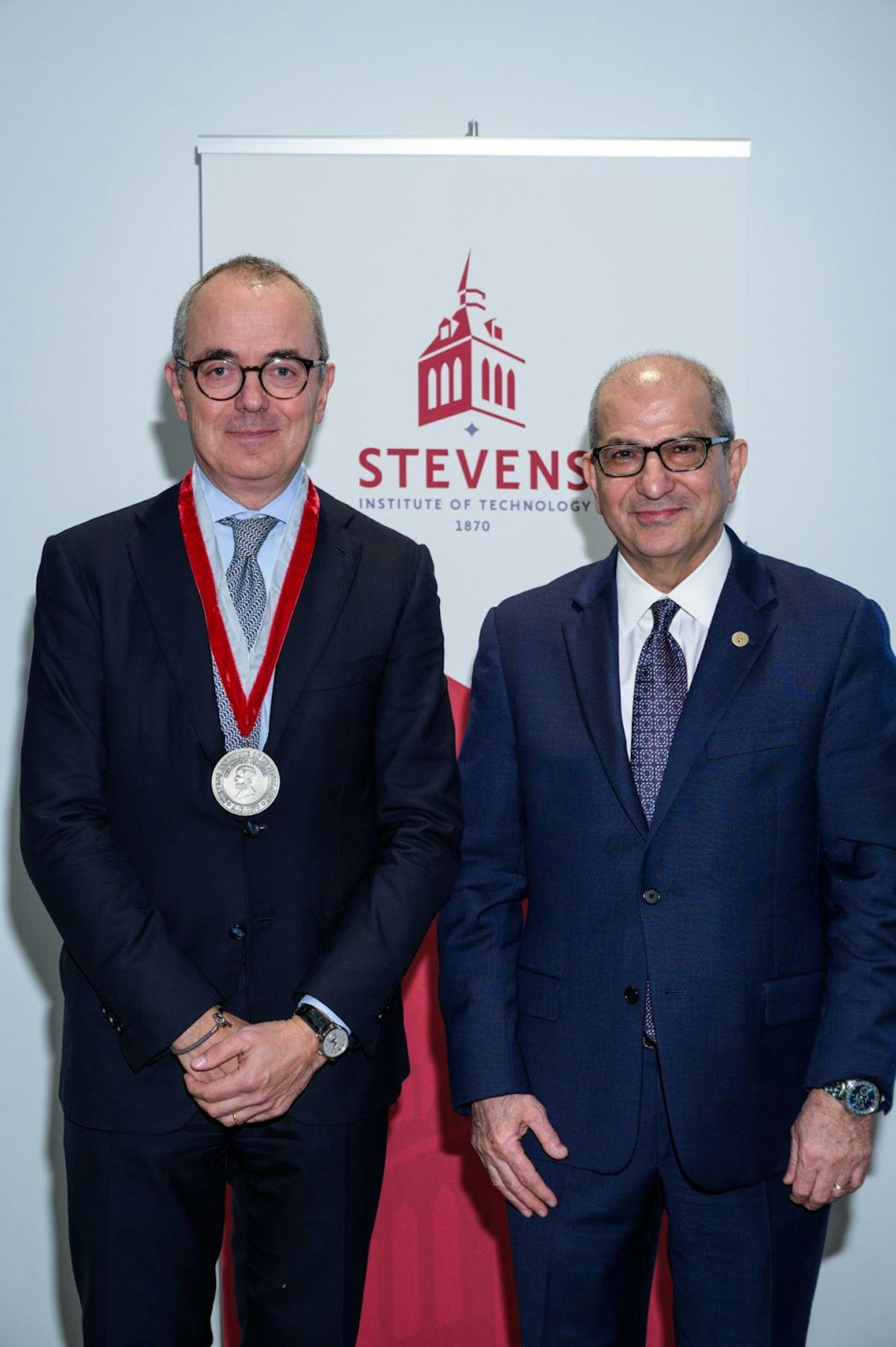 Giovanni Caforio receives a medal from Stevens President Nariman Farvardin