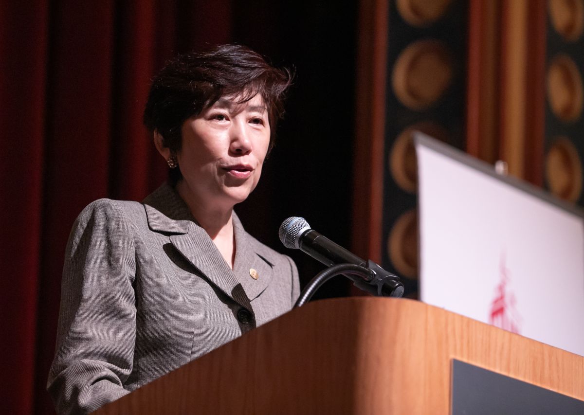 Jean Zu standing at a podium during her keynote speech at the Stevens Math Olympiad