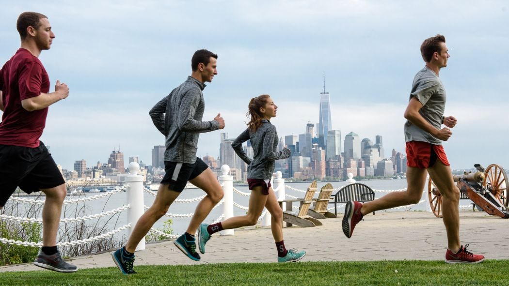 Students running on campus