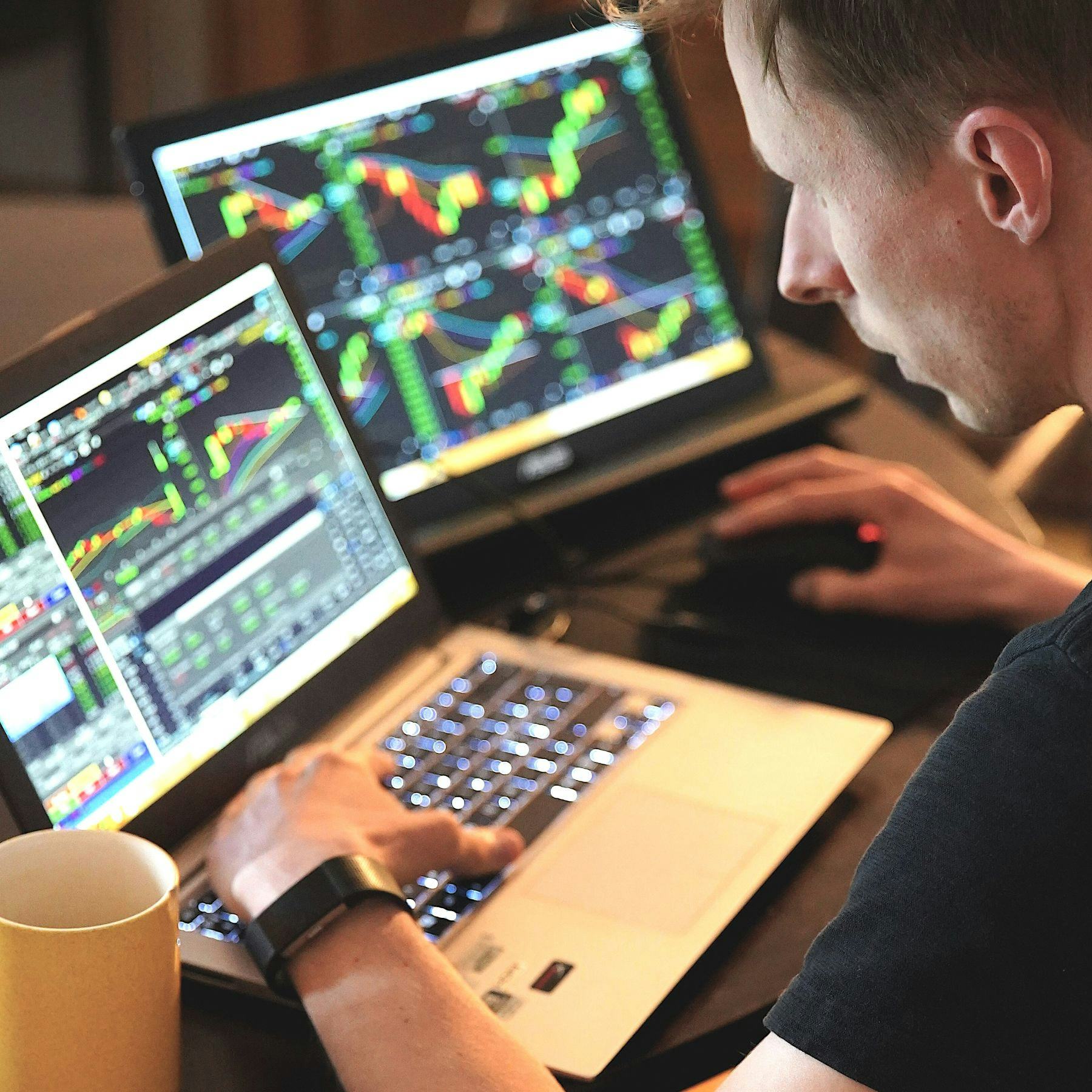 Trader using phone to check stock markets