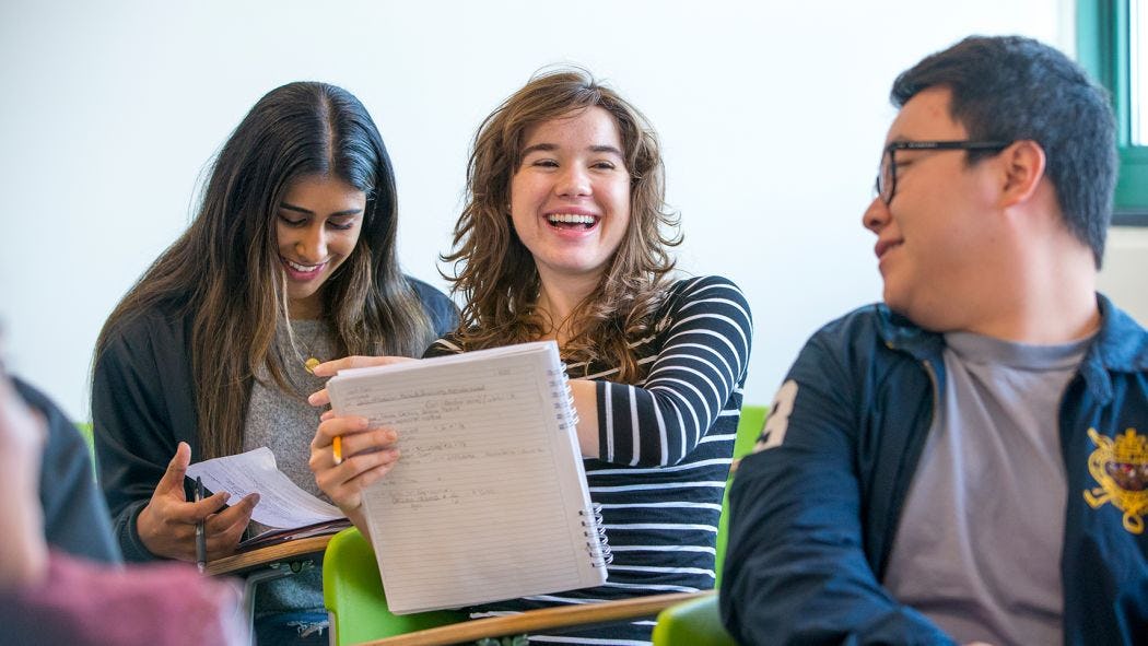 Students laughing in a classroom