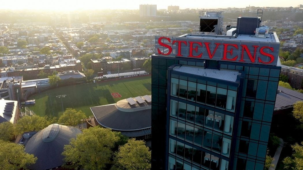 Aerial photo of UCC building with Stevens sign