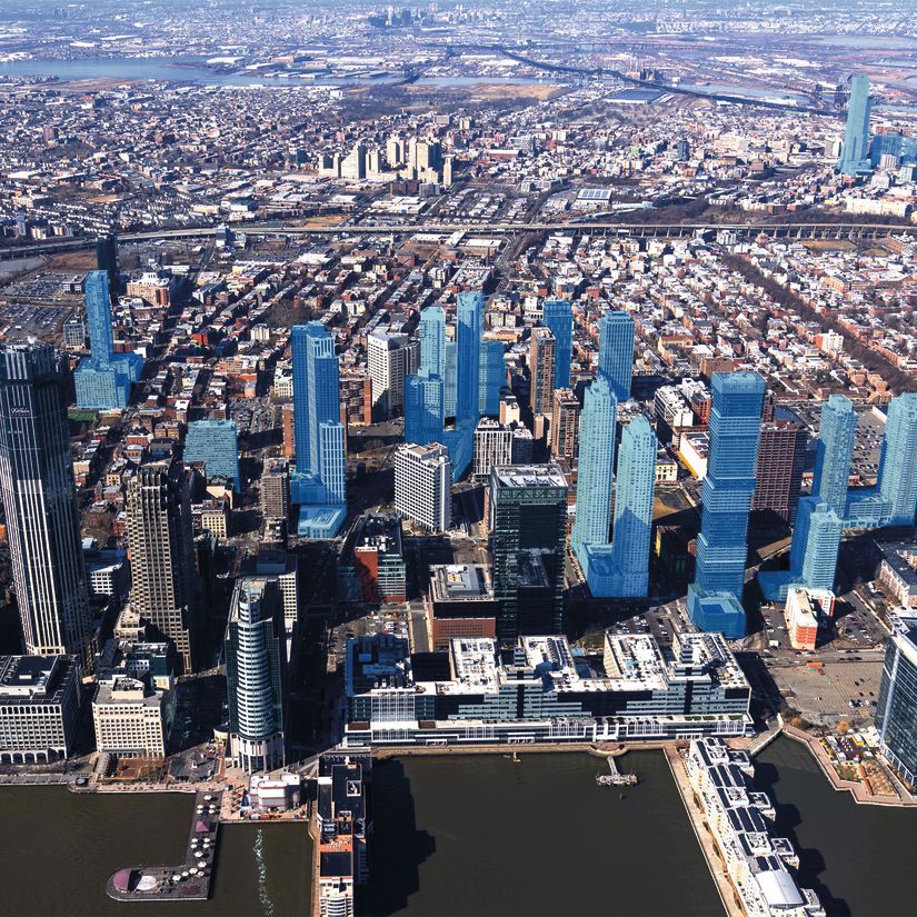 A bird’s eye view of the Jersey City Skyline on a clear day. Toward the middle of the photo, more than a dozen of the city’s buildings are shaded in light blue to denote the properties that alumni Anthony Diaco’s company has built.  