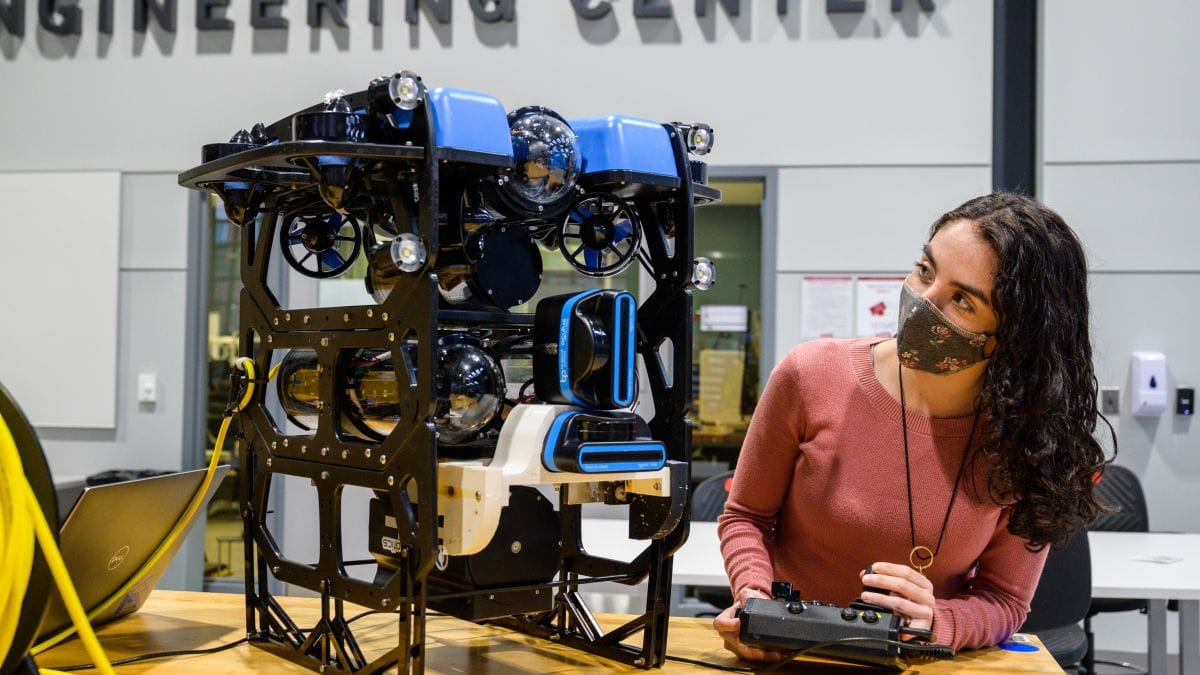 Student in lab works on underwater drone