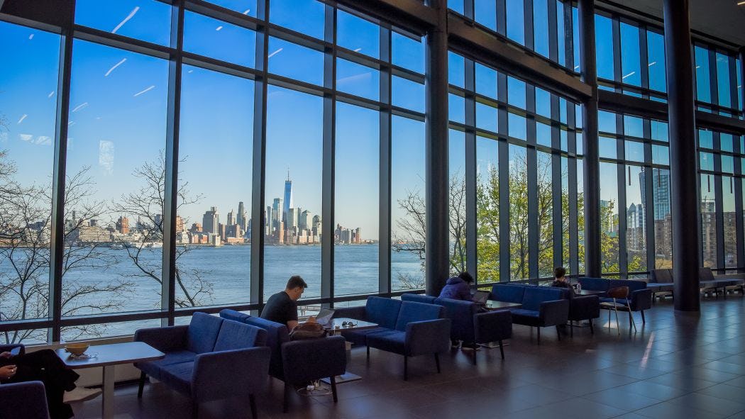 Student studying in UCC with NYC skyline in the background