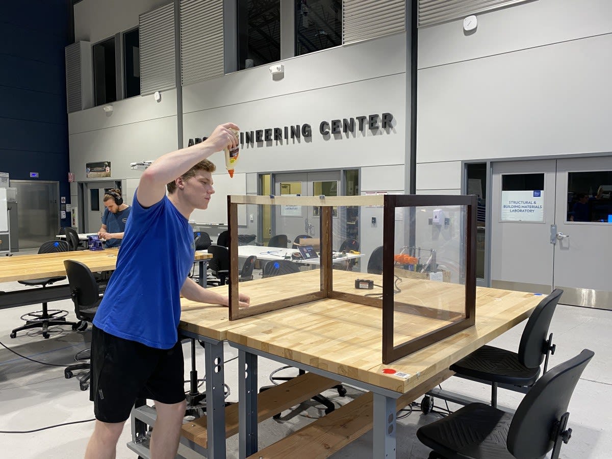 Student working on the greenhouse