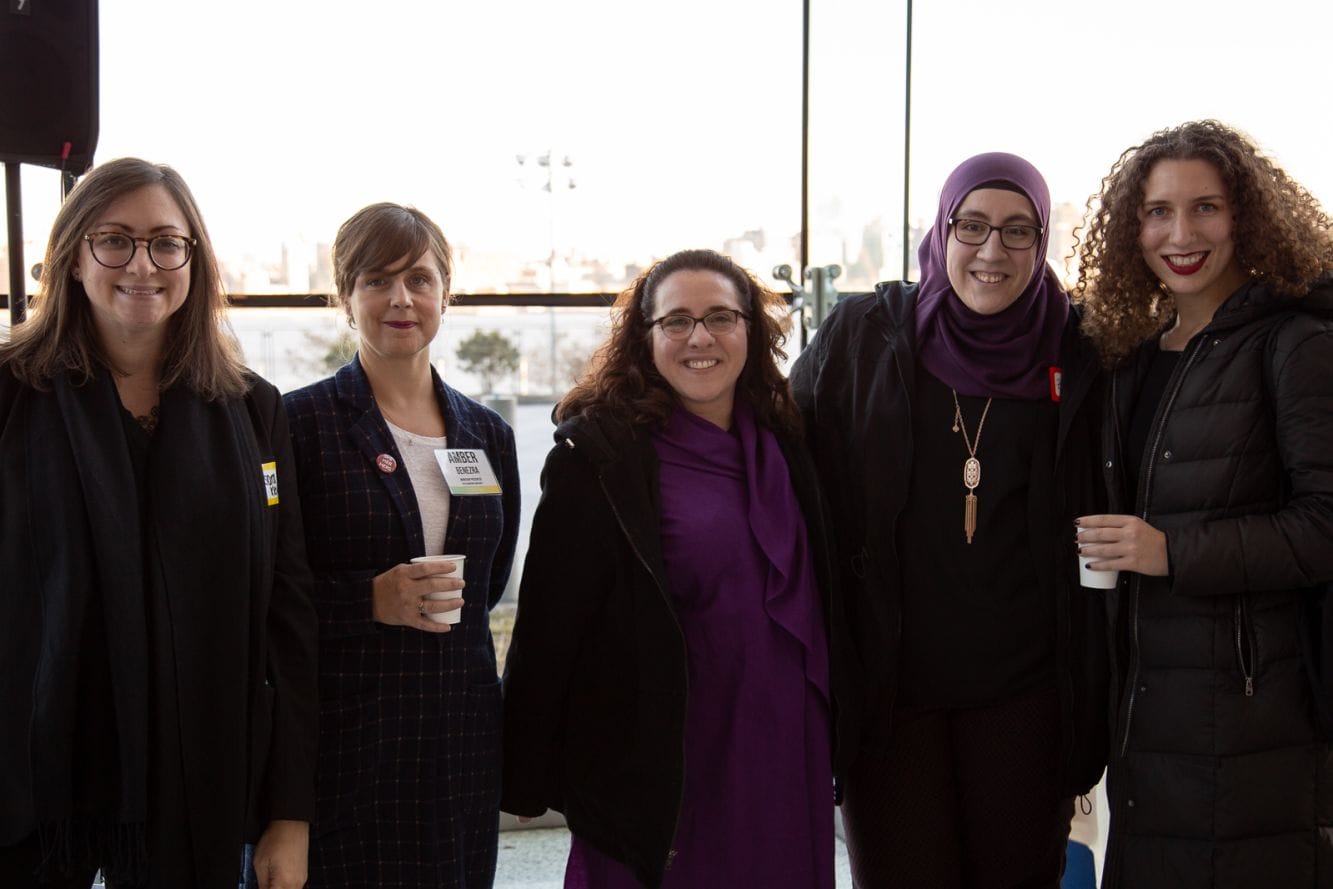 group of students and staff smiling at the conference