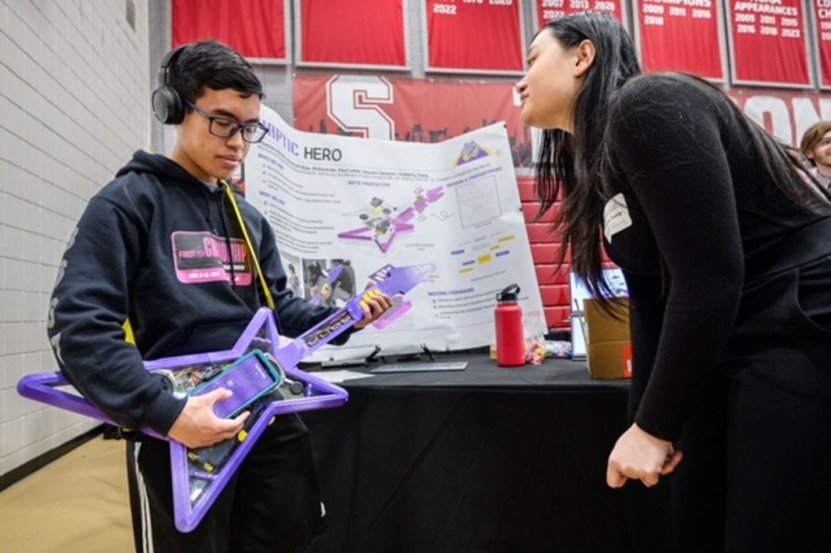 Haptic guitar being demonstrated at 2024 Innovation Expo