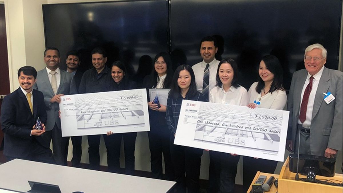 The two teams of Stevens students that tied for first place in the UBS machine-learning competition standing with Apurva Mehta and Perry Renjen from UBS and Stevens professor Dr. Ted Stohr.