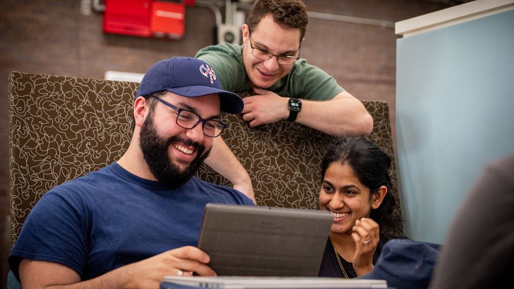 Students laughing at screen