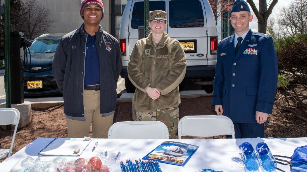 Students in Uniform at information table 