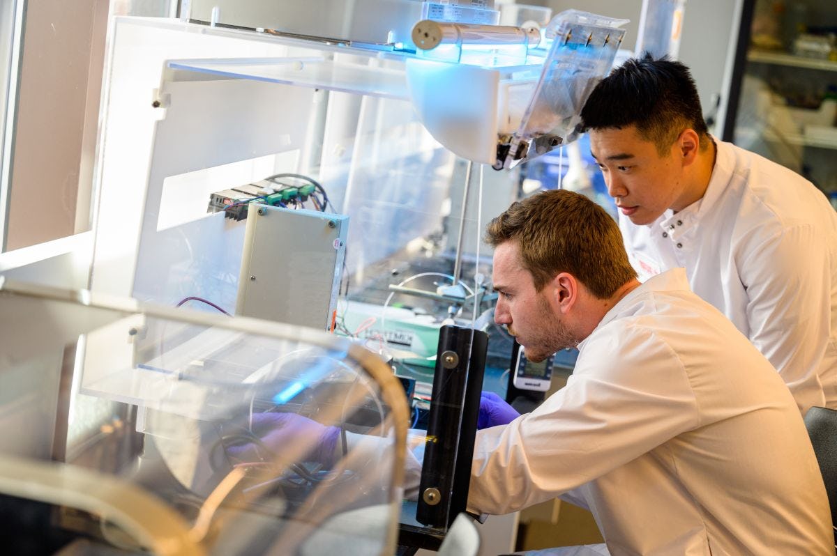 Two biomedical engineering Ph.D. students working in the Center for Healthcare Innovation tissue engineering laboratory