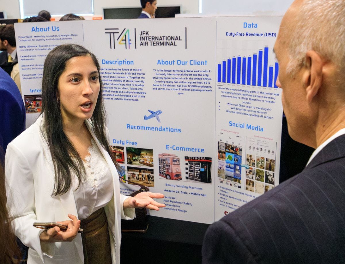 Stevens student describing her JFK Airport-related consultancy project to visitor to 2023 Innovation Expo